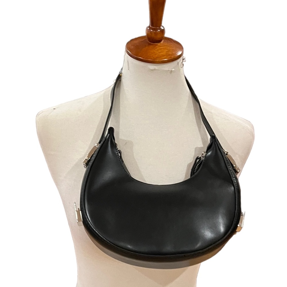 Saddle style adjustable straps black handbag only used in a photo shoot